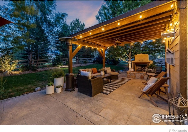 3290 Discovery Ct, Broomfield, CO 80023 - view of patio / terrace with an outdoor living space with a fireplace