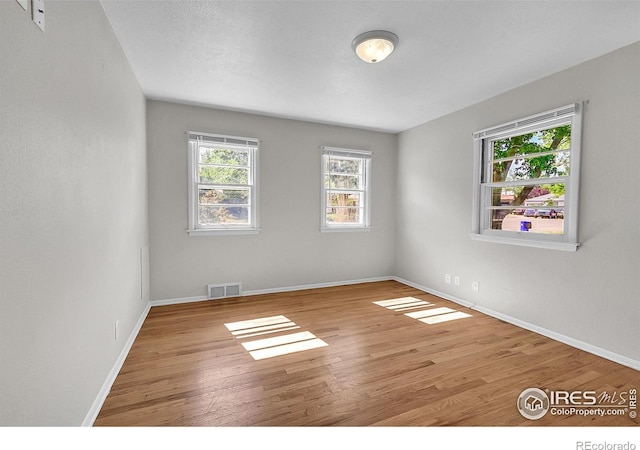 2416 15th Ave, Greeley, CO 80631 - unfurnished room featuring wood finished floors and baseboards