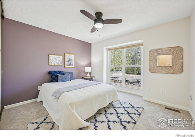 951 Vetch Cir, Lafayette, CO 80026 - bedroom featuring carpet flooring, a textured ceiling, and ceiling fan