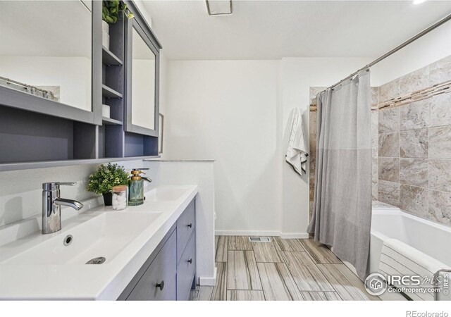 951 Vetch Cir, Lafayette, CO 80026 - bathroom with double vanity and shower / tub combo with curtain