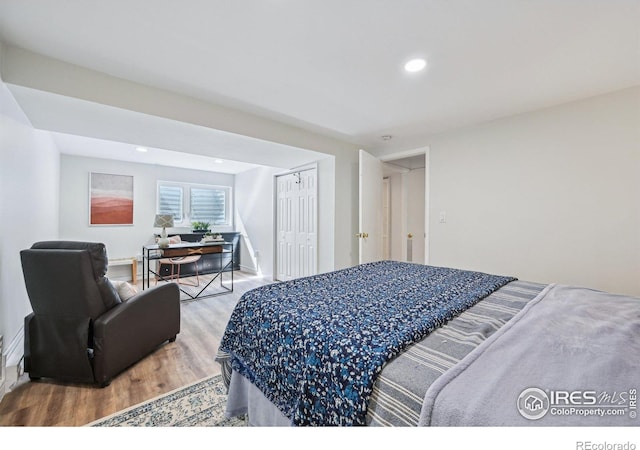 951 Vetch Cir, Lafayette, CO 80026 - bedroom with wood finished floors, recessed lighting, and a closet