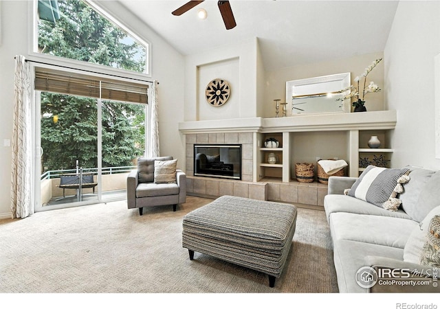 4332 Clay Commons Ct, Boulder, CO 80303 - carpeted living area featuring a ceiling fan, a tile fireplace, and high vaulted ceiling