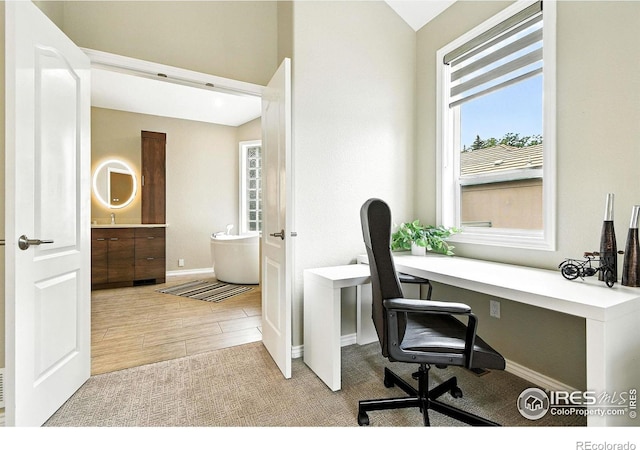 4332 Clay Commons Ct, Boulder, CO 80303 - office featuring plenty of natural light, lofted ceiling, and wood finished floors