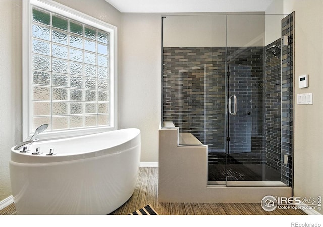 4332 Clay Commons Ct, Boulder, CO 80303 - bathroom with a freestanding tub, plenty of natural light, a shower stall, and wood finished floors