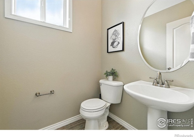4332 Clay Commons Ct, Boulder, CO 80303 - half bathroom featuring toilet and wood finished floors