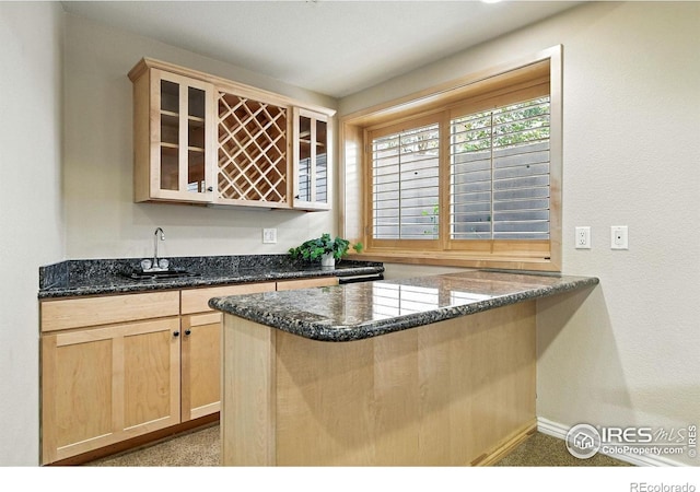 4332 Clay Commons Ct, Boulder, CO 80303 - kitchen with light brown cabinets, glass insert cabinets, a peninsula, and dark stone countertops