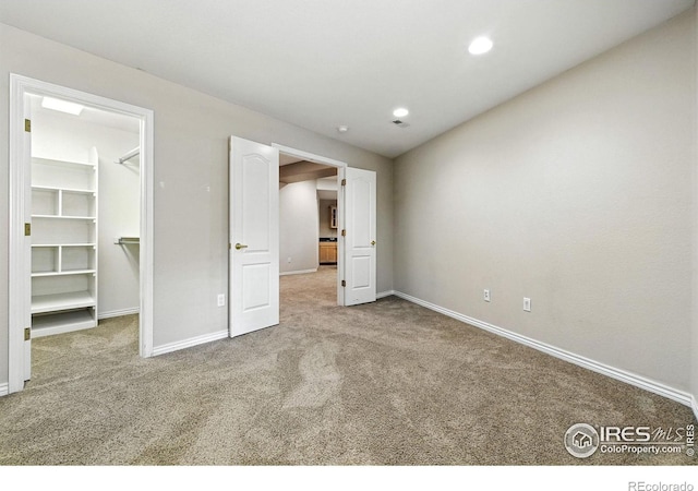 4332 Clay Commons Ct, Boulder, CO 80303 - unfurnished bedroom with carpet floors, a walk in closet, and recessed lighting