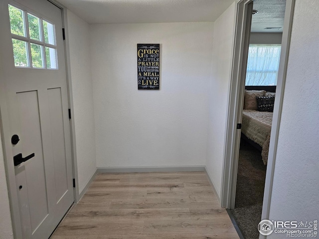 202 N 7th Ave, Sterling, CO 80751 - corridor featuring light wood-style floors and baseboards