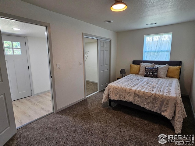 202 N 7th Ave, Sterling, CO 80751 - carpeted bedroom featuring a closet and a textured ceiling