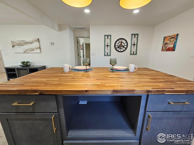 202 N 7th Ave, Sterling, CO 80751 - kitchen with wood counters, recessed lighting, and blue cabinets