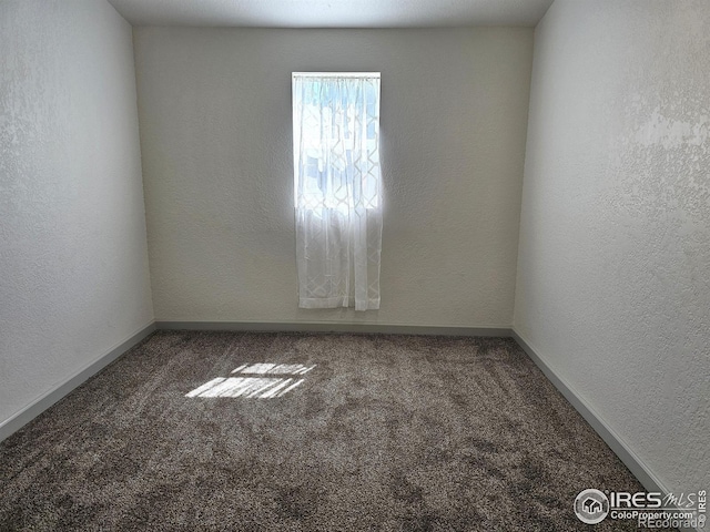 202 N 7th Ave, Sterling, CO 80751 - spare room featuring carpet floors and a textured wall