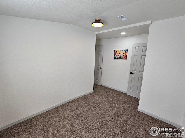 202 N 7th Ave, Sterling, CO 80751 - carpeted empty room with a textured ceiling and recessed lighting