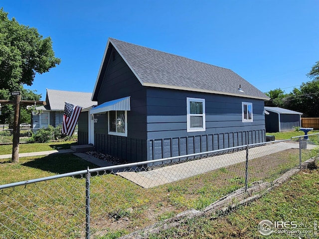 202 N 7th Ave, Sterling, CO 80751 - view of property exterior featuring roof with shingles