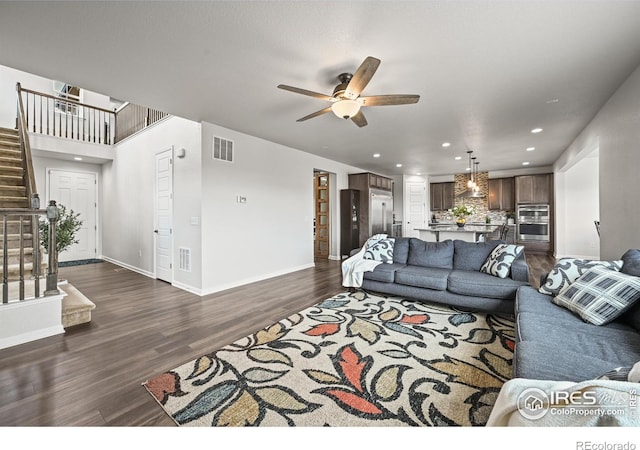 12648 Canoe St, Firestone, CO 80504 - living room with stairway, a ceiling fan, recessed lighting, and dark wood-style floors