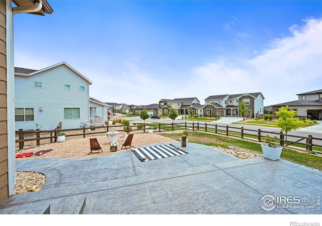 12648 Canoe St, Firestone, CO 80504 - view of patio featuring a residential view