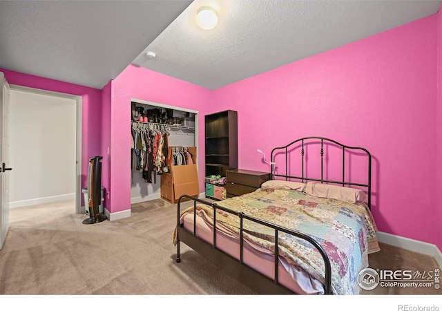 12648 Canoe St, Firestone, CO 80504 - carpeted bedroom with a closet and a textured ceiling