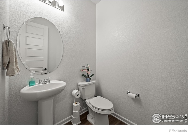 12648 Canoe St, Firestone, CO 80504 - bathroom with wood finished floors and a sink