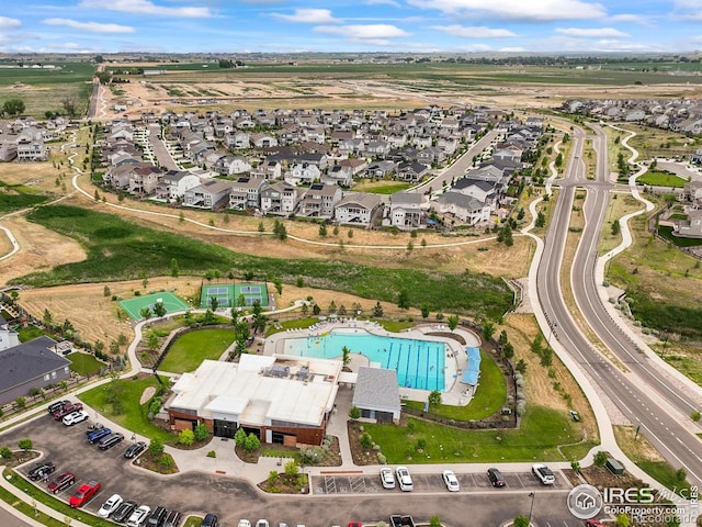 12648 Canoe St, Firestone, CO 80504 - aerial view of property and surrounding area featuring a pool and nearby suburban area