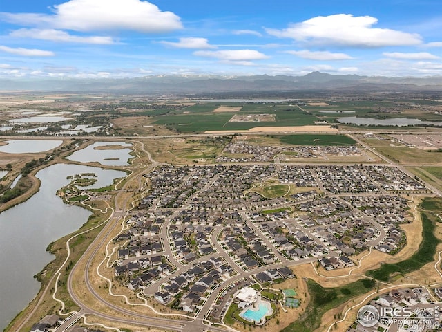 12648 Canoe St, Firestone, CO 80504 - aerial view of property's location featuring a water and mountain view and nearby suburban area