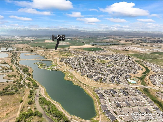 12648 Canoe St, Firestone, CO 80504 - aerial view of property's location featuring a water and mountain view and nearby suburban area