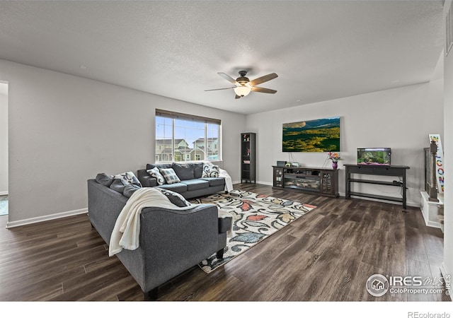 12648 Canoe St, Firestone, CO 80504 - living area with wood finished floors, a ceiling fan, and a textured ceiling