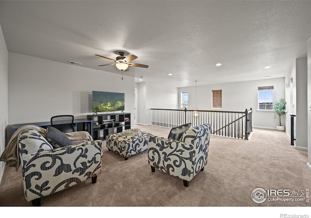 12648 Canoe St, Firestone, CO 80504 - living room with carpet flooring, a textured ceiling, ceiling fan, and recessed lighting