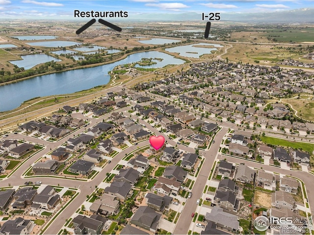 12648 Canoe St, Firestone, CO 80504 - aerial view of residential area featuring a nearby body of water