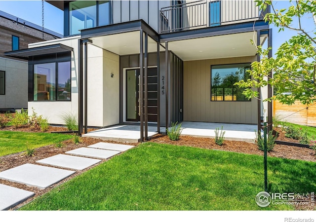 2145 Vine Ave, Boulder, CO 80304 - entrance to property with a balcony, a lawn, and covered porch