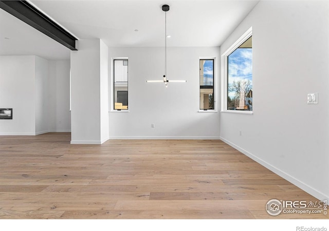 2145 Vine Ave, Boulder, CO 80304 - unfurnished dining area with baseboards and light wood-type flooring