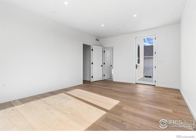 2145 Vine Ave, Boulder, CO 80304 - unfurnished bedroom featuring recessed lighting, light wood-style flooring, and access to exterior