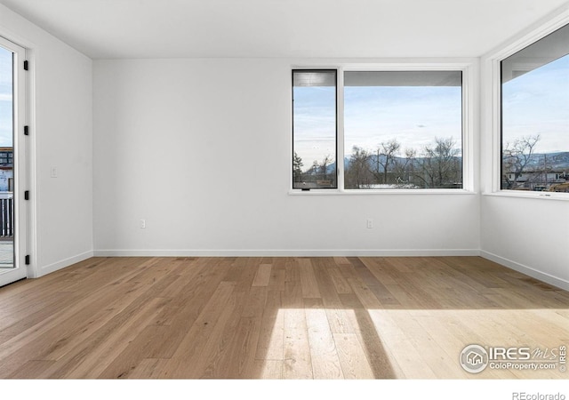 2145 Vine Ave, Boulder, CO 80304 - unfurnished room with light wood-type flooring and healthy amount of natural light