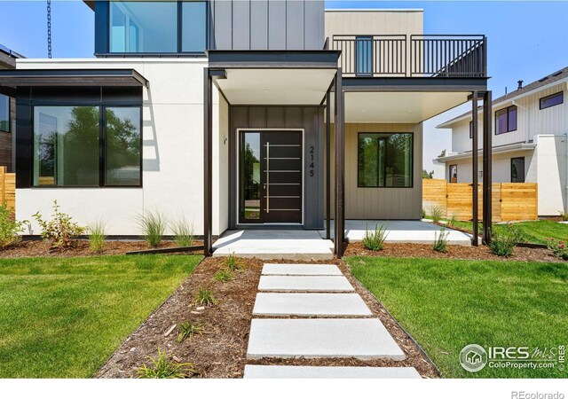 2145 Vine Ave, Boulder, CO 80304 - entrance to property featuring a balcony, covered porch, and board and batten siding