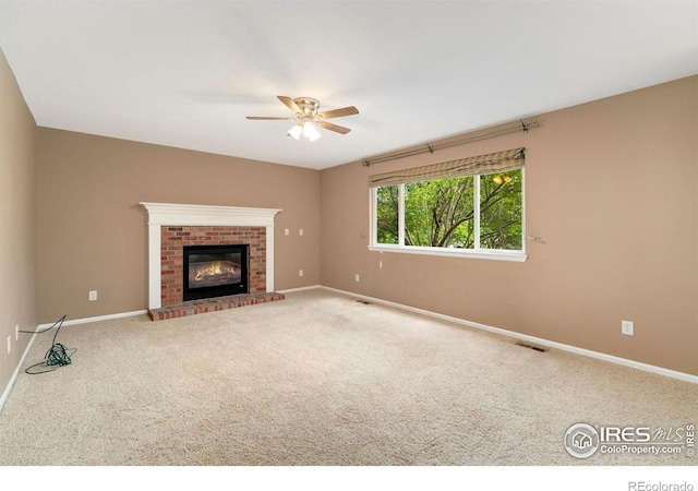 17132 E 104th Way, Commerce City, CO 80022 - unfurnished living room featuring ceiling fan, carpet flooring, and a brick fireplace
