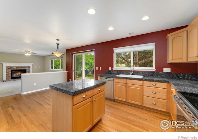 17132 E 104th Way, Commerce City, CO 80022 - kitchen featuring stainless steel appliances, tile counters, light wood-style floors, a center island, and recessed lighting
