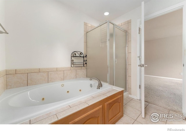 17132 E 104th Way, Commerce City, CO 80022 - full bath with a shower stall, a whirlpool tub, and tile patterned floors