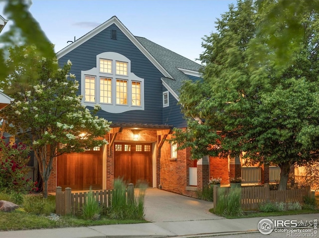 901 Terrace Cir S, Boulder, CO 80304 - traditional-style house with driveway, a garage, brick siding, and roof with shingles
