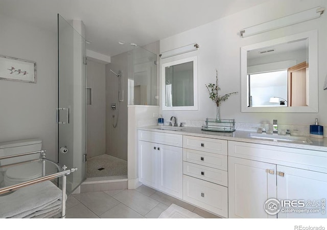 901 Terrace Cir S, Boulder, CO 80304 - bathroom with tile patterned flooring, double vanity, and a stall shower