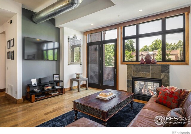 820 Pearl St, Boulder, CO 80302 - living room featuring wood finished floors, a tile fireplace, and recessed lighting