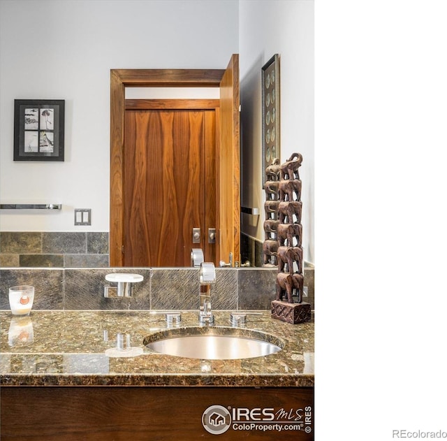 820 Pearl St, Boulder, CO 80302 - bathroom featuring vanity and backsplash