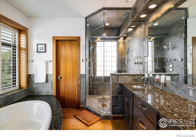 820 Pearl St, Boulder, CO 80302 - bathroom featuring a shower stall, vanity, a bath, and wood finished floors