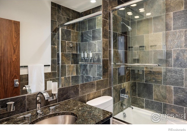 820 Pearl St, Boulder, CO 80302 - bathroom with vanity, shower / bath combination with glass door, tile walls, and tasteful backsplash