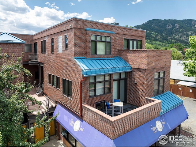 820 Pearl St, Boulder, CO 80302 - view of building exterior with a mountain view