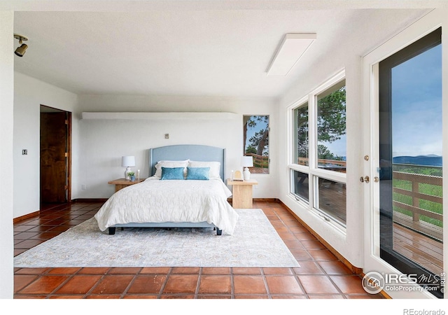 3884 Douglas Mountain Dr, Golden, CO 80403 - bedroom with tile patterned flooring and baseboards