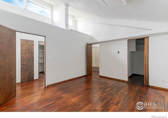 3884 Douglas Mountain Dr, Golden, CO 80403 - unfurnished room featuring wood finished floors and a high ceiling