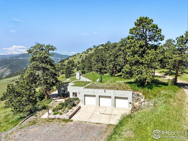 3884 Douglas Mountain Dr, Golden, CO 80403 - view of subject property featuring a mountainous background
