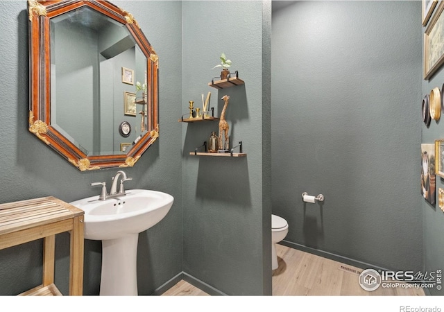 5199 Beckworth St, Timnath, CO 80547 - half bathroom with wood finished floors and toilet