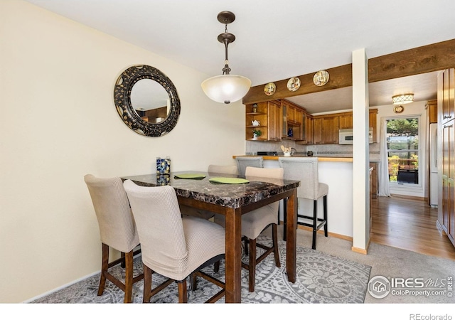 1620 Bradley Ct, Boulder, CO 80305 - dining area featuring baseboards and light colored carpet