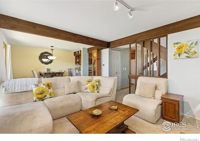 1620 Bradley Ct, Boulder, CO 80305 - carpeted living room featuring stairway, rail lighting, and beamed ceiling
