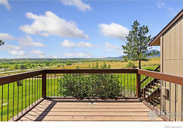 1620 Bradley Ct, Boulder, CO 80305 - wooden deck with a view of countryside and a lawn