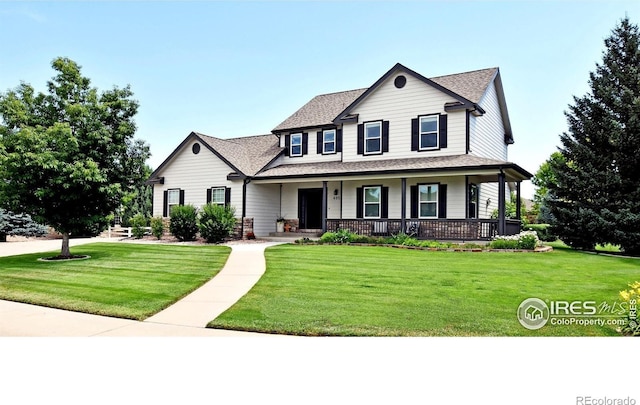 405 Ridgeview Ct, Johnstown, CO 80534 - view of front of property featuring covered porch, a front yard, and roof with shingles